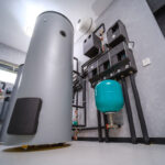 Modern electric boiler room in the house. Equipment for water heating system with automatic control unit